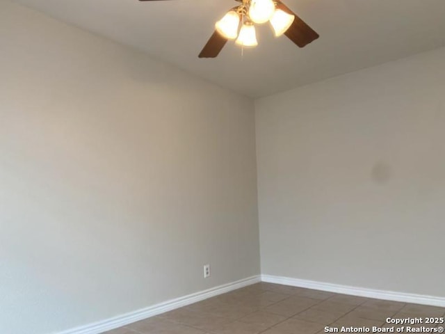 unfurnished room featuring baseboards, ceiling fan, and light tile patterned floors
