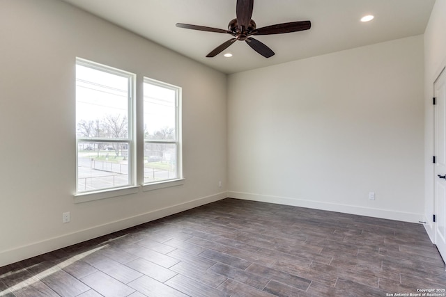 spare room with baseboards, a ceiling fan, recessed lighting, and dark wood-style floors