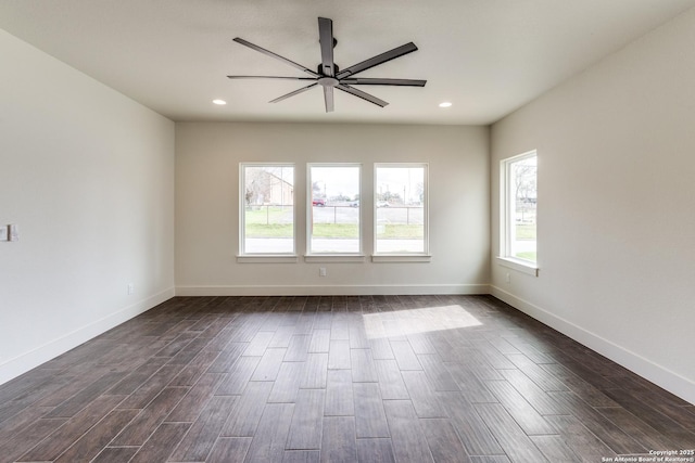 spare room with recessed lighting, dark wood finished floors, ceiling fan, and baseboards