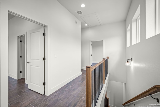 182 Torrey, New Braunfels, TX 78130 - corridor with attic access, an upstairs landing, dark wood-style flooring, baseboards, and recessed lighting