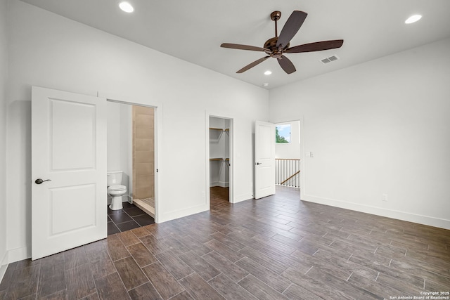182 Torrey, New Braunfels, TX 78130 - unfurnished bedroom with wood finished floors, a spacious closet, baseboards, ensuite bathroom, and recessed lighting