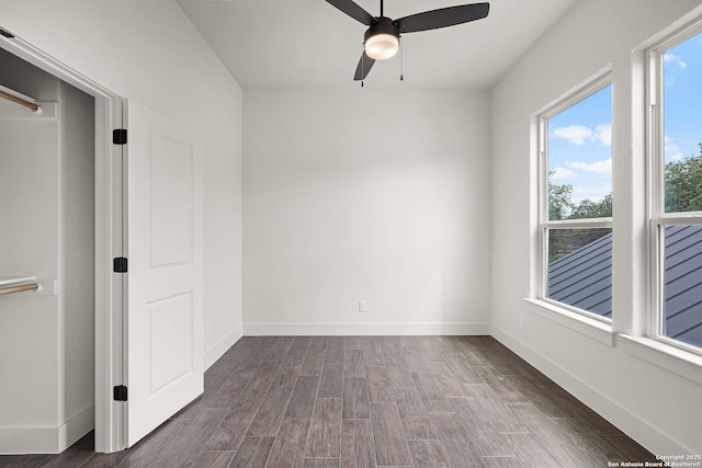 182 Torrey, New Braunfels, TX 78130 - empty room with ceiling fan, dark wood-style flooring, and baseboards