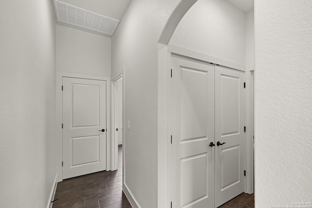 182 Torrey, New Braunfels, TX 78130 - hallway with dark wood-type flooring, baseboards, and arched walkways