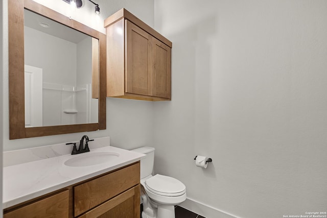 182 Torrey, New Braunfels, TX 78130 - bathroom with vanity, toilet, and baseboards