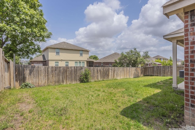 view of yard with a fenced backyard and cooling unit
