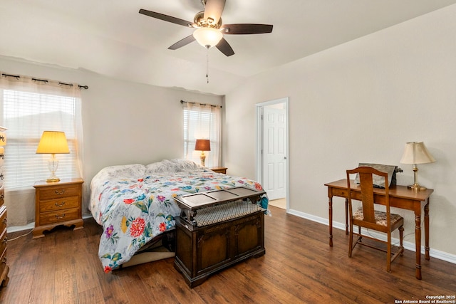 bedroom featuring baseboards, dark wood-style floors, and multiple windows