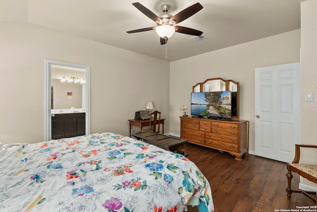 bedroom featuring a ceiling fan, visible vents, dark wood-style floors, and ensuite bath