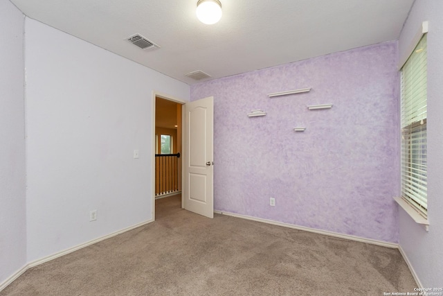 1843 Gray Fox, San Antonio, TX 78245 - carpeted empty room with baseboards, visible vents, and a healthy amount of sunlight