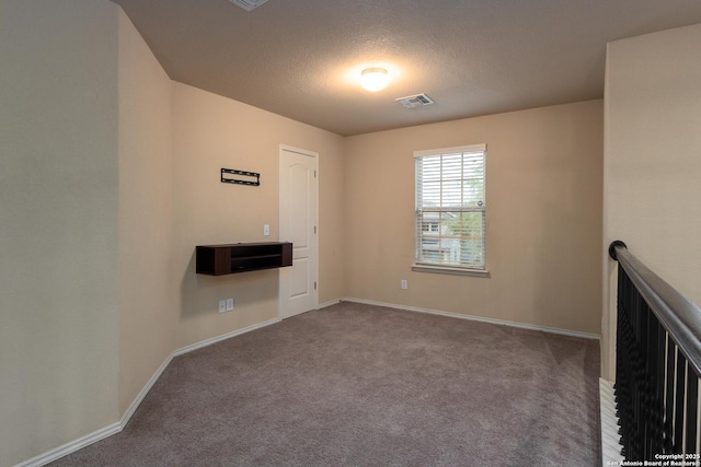 1843 Gray Fox, San Antonio, TX 78245 - spare room with carpet floors, a textured ceiling, baseboards, and visible vents