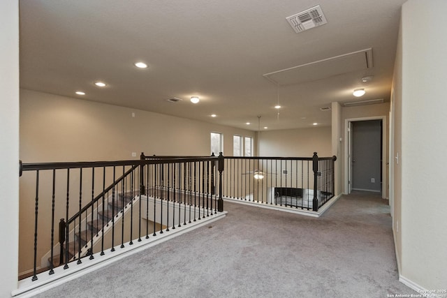 1843 Gray Fox, San Antonio, TX 78245 - hall with visible vents, attic access, recessed lighting, carpet flooring, and an upstairs landing