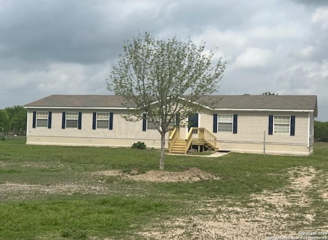 manufactured / mobile home with a front lawn