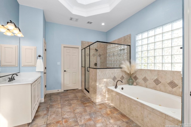 bathroom featuring vanity, baseboards, visible vents, a garden tub, and a stall shower