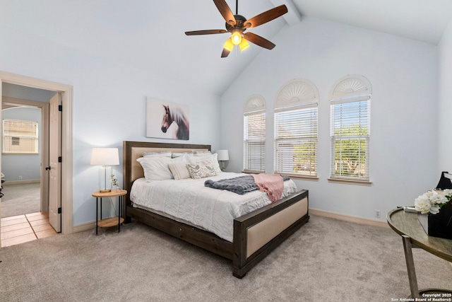 carpeted bedroom featuring baseboards, high vaulted ceiling, ceiling fan, and beam ceiling