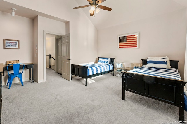 bedroom with carpet floors, baseboards, and vaulted ceiling