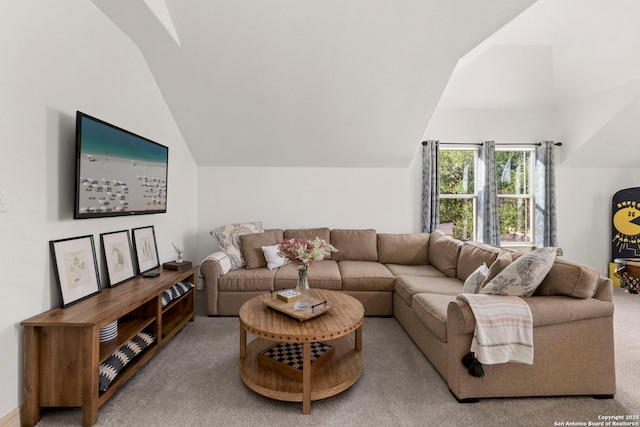 living room featuring carpet flooring and vaulted ceiling