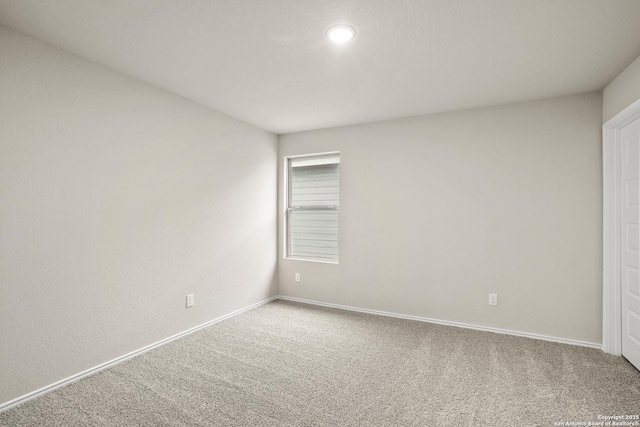 carpeted spare room with baseboards and recessed lighting