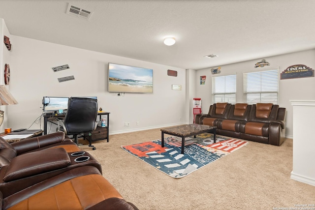 living area featuring visible vents, carpet, and baseboards