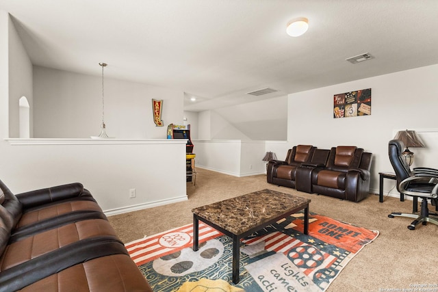 living room with visible vents, carpet, and baseboards