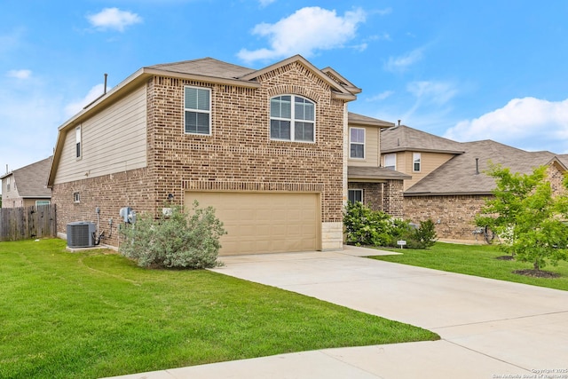 traditional-style house featuring brick siding, an attached garage, driveway, and a front lawn