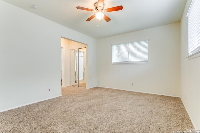 7442 Castle Trail Dr, San Antonio, TX 78218 - empty room with ceiling fan, light colored carpet, and plenty of natural light