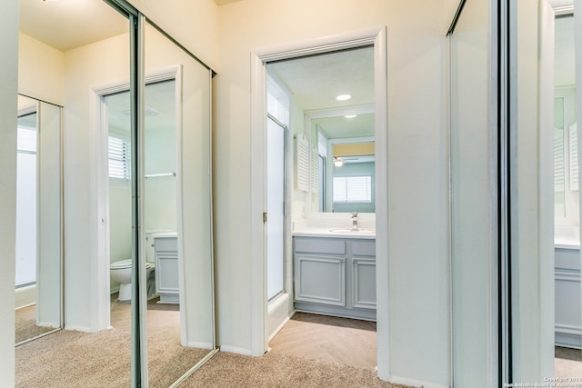 7442 Castle Trail Dr, San Antonio, TX 78218 - bathroom with toilet, baseboards, and vanity
