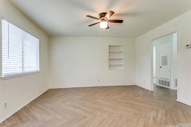 7442 Castle Trail Dr, San Antonio, TX 78218 - empty room featuring visible vents, a ceiling fan, and built in shelves