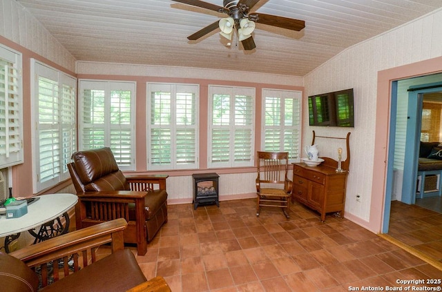 sunroom / solarium with a wood stove