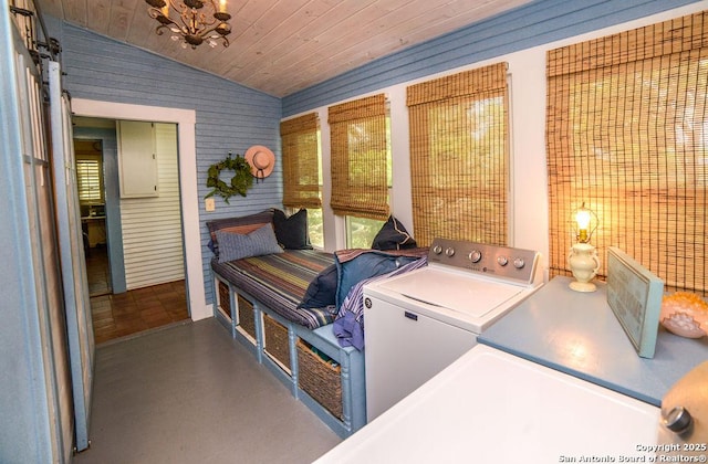 laundry room featuring wood ceiling, plenty of natural light, laundry area, and washing machine and dryer