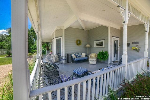 view of patio with a porch and an outdoor hangout area