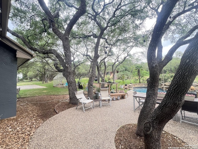 view of patio / terrace with an outdoor pool