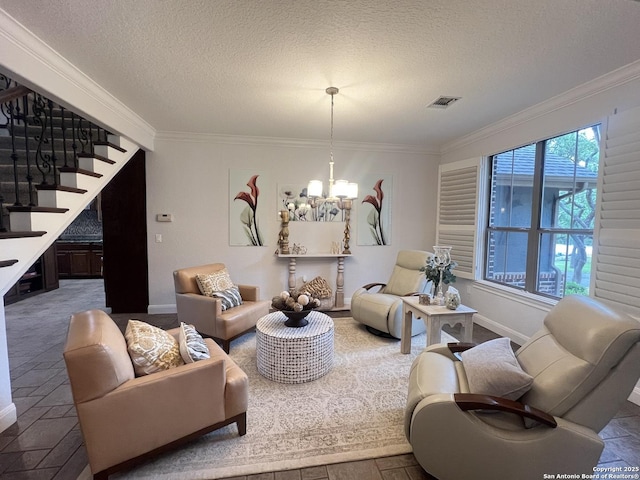 living area with crown molding, a textured ceiling, an inviting chandelier, and stairway