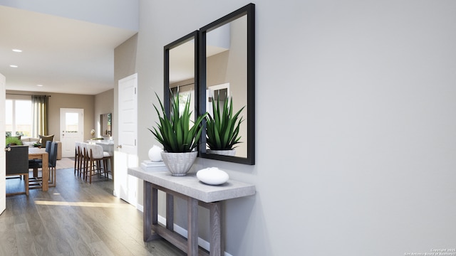 hallway featuring plenty of natural light, recessed lighting, and wood finished floors