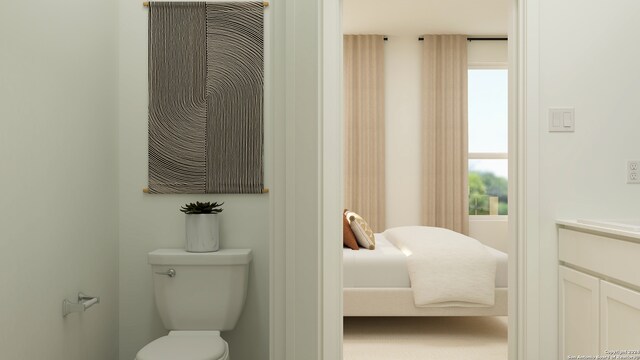 ensuite bathroom featuring toilet and ensuite bathroom
