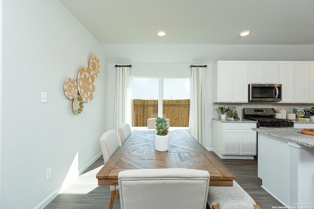 dining room featuring recessed lighting, baseboards, and dark wood finished floors