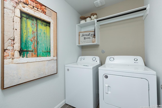 laundry area featuring baseboards, laundry area, and washing machine and dryer