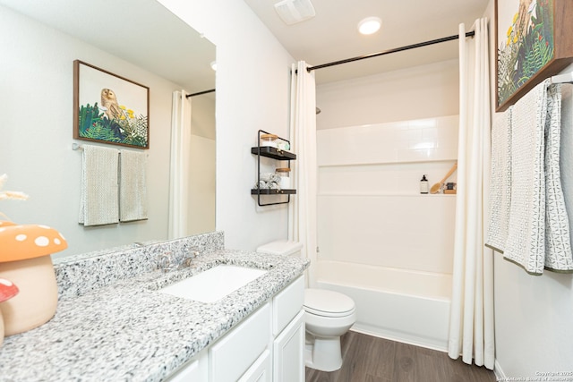 full bath featuring vanity, shower / bathtub combination with curtain, wood finished floors, and toilet