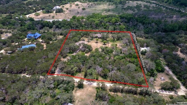 aerial view featuring a view of trees