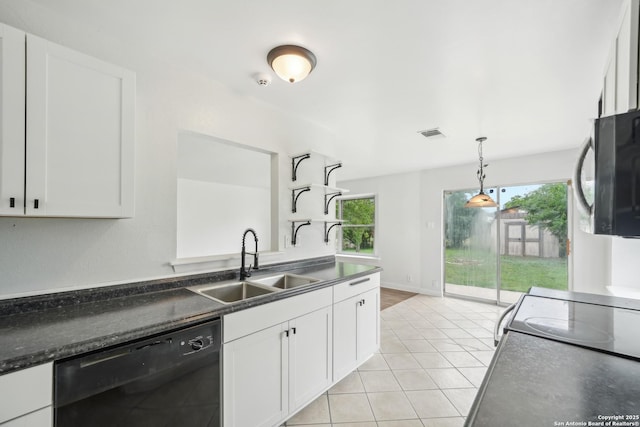 kitchen featuring white cabinetry, dark countertops, a sink, and black appliances