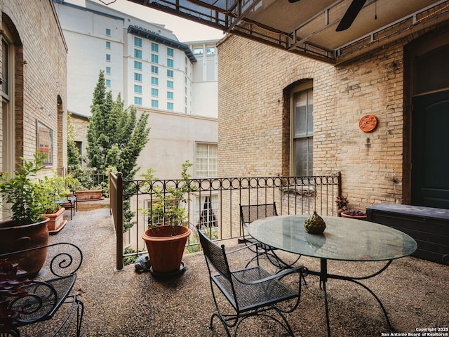 balcony featuring ceiling fan