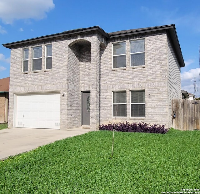 view of front of house featuring a garage, fence, driveway, and a front yard