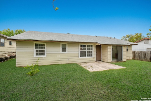 back of house with a lawn, fence, and a patio area