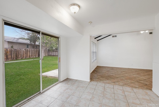 unfurnished room with light tile patterned flooring and visible vents