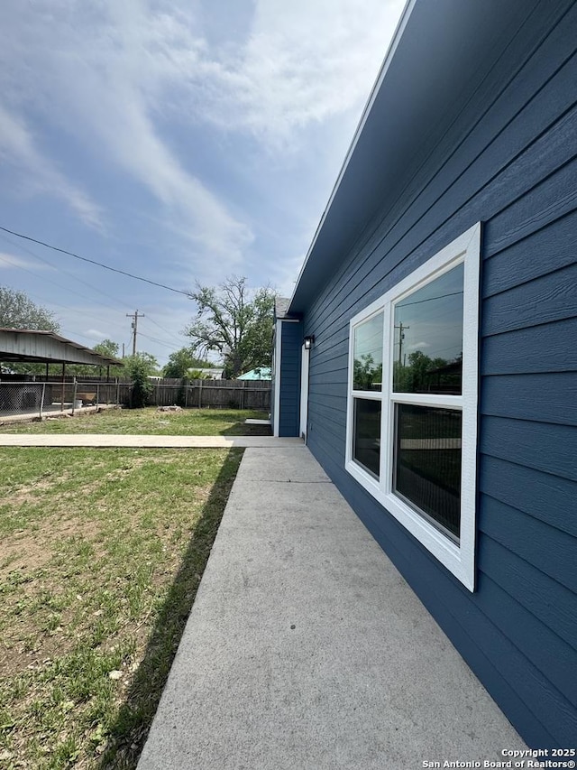 view of yard featuring fence and a patio area