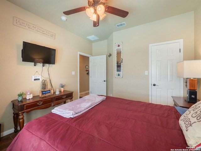 bedroom featuring visible vents, a ceiling fan, and baseboards