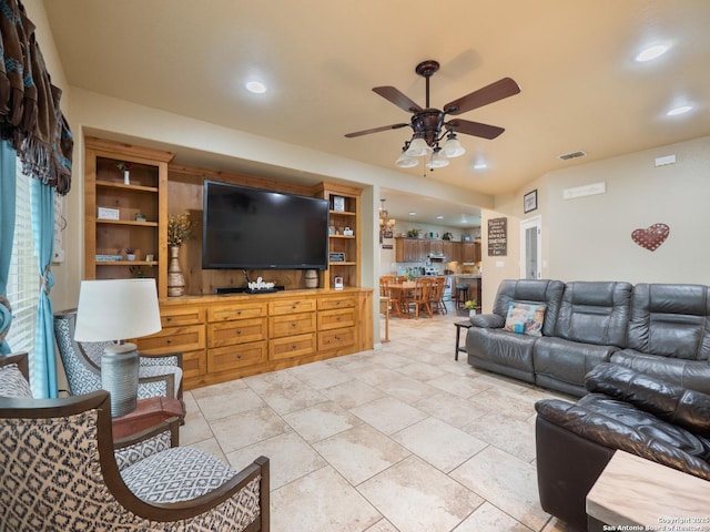 living area featuring a ceiling fan, recessed lighting, and visible vents