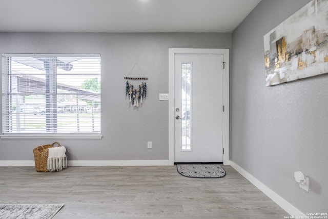 8010 Remuda, San Antonio, TX 78227 - entryway with baseboards and wood finished floors