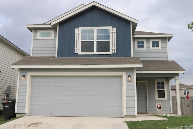 view of front facade featuring board and batten siding, a porch, driveway, a garage, and a shingled roof