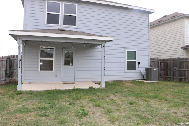 6002 Bluestem Way, San Antonio, TX 78218 - back of house featuring a fenced backyard, a patio, a yard, and central AC
