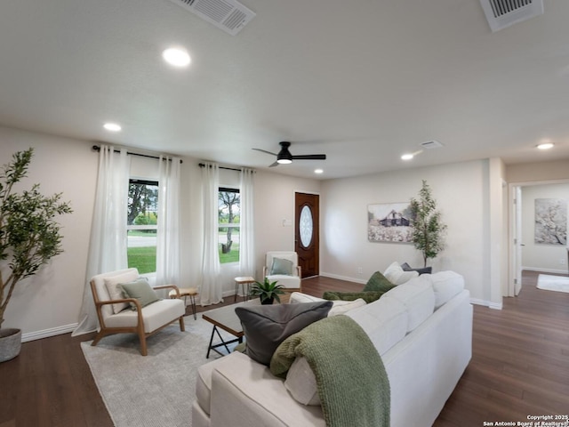 living area with dark wood-style flooring, recessed lighting, a ceiling fan, and visible vents