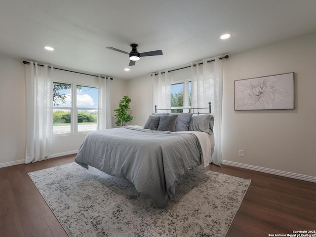 bedroom featuring recessed lighting, baseboards, ceiling fan, and dark wood-type flooring
